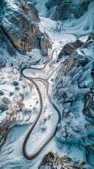 Aerial view of the winding Snake Road in winter in the Dolomite Alps of Italy