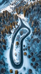 Aerial view of the winding Snake Road in winter in the Dolomite Alps of Italy
