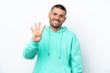 Young caucasian man isolated on white background happy and counting four with fingers