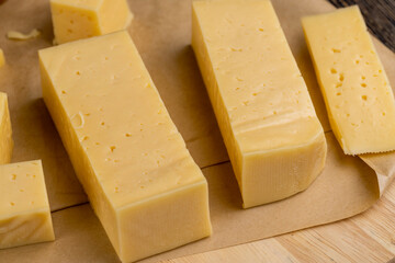 yellow semi-hard cheese with holes