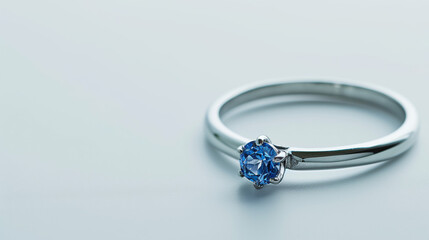 "A Luxurious and Expensive Women's Ring Featuring a Captivating Blue Topaz Gemstone, Isolated on a White Background."