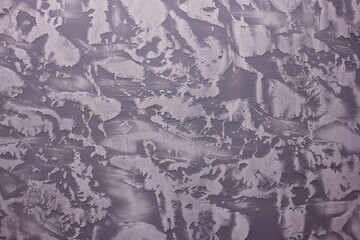 Vintage background with the texture of Venetian plaster. Cold grey grunge.