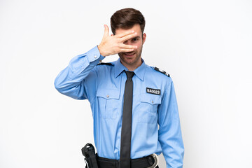 Young police caucasian man isolated on white background covering eyes by hands and smiling