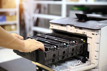 Technician open cover printer fix repair problem and replace drum and ink cartridges and for print scanning fax or copy document or photocopier or photocopy in office workplace service support concept