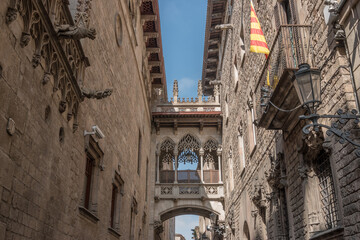 View of bridge between buildings in Barri Gotic quarter of Barcelona, Spain.