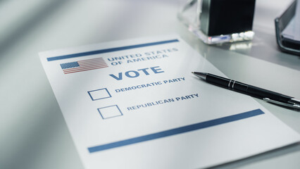 Elections Day Concept. Paper Ballot Lying on a Desk in a Voting Booth with an American Flag and...