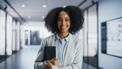 Portrait of Beautiful African Female Dressed in a Casual Suit Standing in an Office. Young Happy...