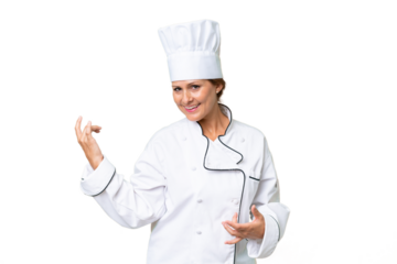 Middle-aged chef woman over isolated background making guitar gesture