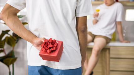 lgbtq man hide surprised valentine gift to his cute partner