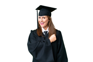 Middle age university graduate woman over isolated background celebrating a victory