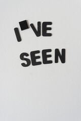 i and square wooden tile painted black and the letters ve and the word 