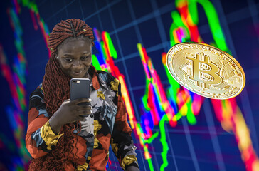 Woman with a mobile phone follows stocks and bitcoin how the development is with the money.