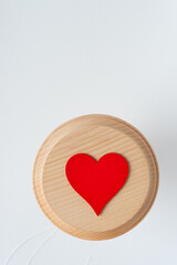 close-up of a red heart on a roundel and blank space