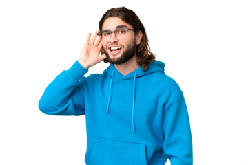 Young handsome man over isolated chroma key background listening to something by putting hand on the ear