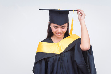A humble female graduate of bachelor of science bows down feeling glad and thankful. Isolated on a white background.