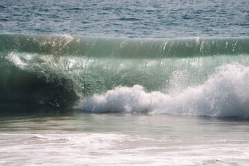wave breaking on the beach