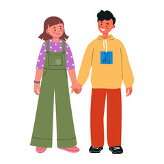 Cheerful boy and girl standing together, holding hands and smiling. Children in bright fashionable casual clothes. Happy childhood concept