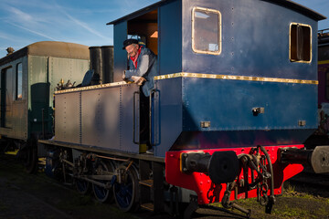 Steam train worker on antique train