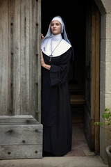 Vintage catholic nun welcoming in chapel