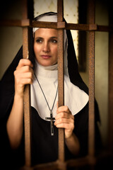 Christian nun at convent gate