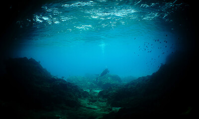 a diver near a cave on the island of Curacao