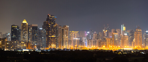 Night panorama of a downtown Dubai area. Banner, wide format