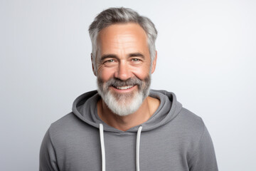 Obraz premium Confident mature man smiling in casual wear. Active aging and lifestyle.
