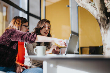Coworkers brainstorming growth strategies, collaborating on market analysis, and developing successful marketing plans in a corporate office.