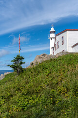 Lobster Cove Head Lighthouse at Gros Morne National Park in Newfoundland, Canada. Overlooking the Gulf of St Lawrence, Bonne Bay and Rocky Harbor. Visitor center with cultural and historical exhibits 