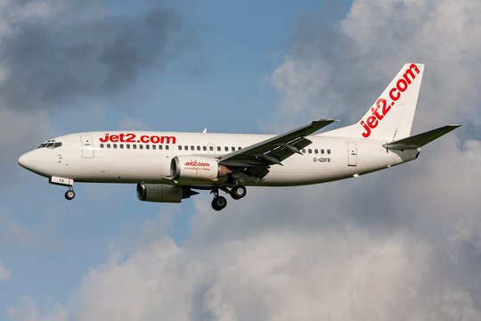 Schiphol, Netherlands - August 19, 2010: British Jet2 Boeing 737-300 with registration G-GDFB in basic white livery on final for Amsterdam Airport Schiphol