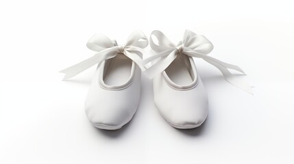 A pair of white ballet pointe shoes with delicate ribbons isolated on white on a clean pure spotless white surface