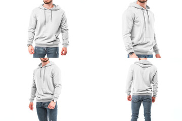 A young man with a beard models a white hoodie in a studio. Design template for printing ads on the...