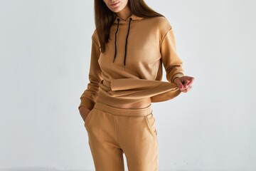 Cozy and Chic in a Beige Hoodie. A Minimal and Modern Style for Casual Fashionistas. Logo and...