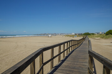 Wooden walkway on the beach of the port of Mar del Plata.