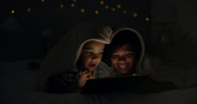 Night, tablet and children on a bed with cartoon, gaming or streaming movie, video of film at home. Family, siblings or kids in a bedroom with love, bonding and digital, search or storytelling app