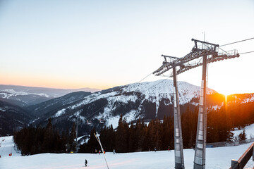 ski lift in the mountains with a beautiful sky