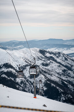 ski lift in the mountains with a beautiful sky