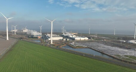 Datacenter in the Eemshaven, internet infrastructure building. Sustainable energy using wind turbines. Birds eye aerial drone view. - Powered by Adobe