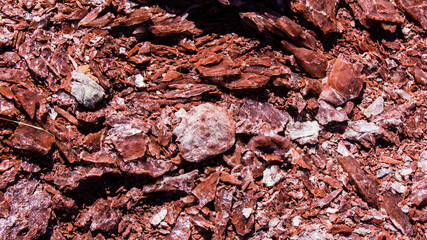 Red stones, blue sky, green water