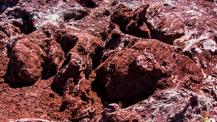 Red stones, blue sky, green water