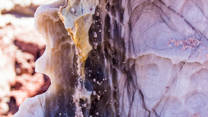 Red stones, blue sky, green water