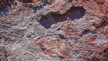 Red stones, blue sky, green water