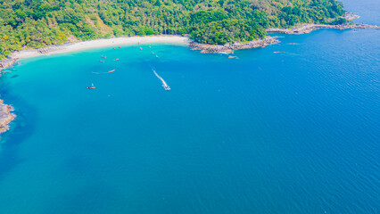 Paradise beach Phuket Patong. aerial top view amazing freedom beach small white sand beach with perfect nature. white wave hit the rock around island. green forest peaceful. green sea, landscape.