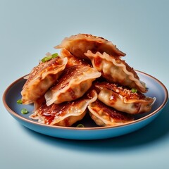 Traditional Jiaozi, gyoza or kyoza: a dish of Chinese as well as Japanese and Korean cuisine. Dumplings are laid out on a plate with sauce for serving in a cafe or restaurant.
