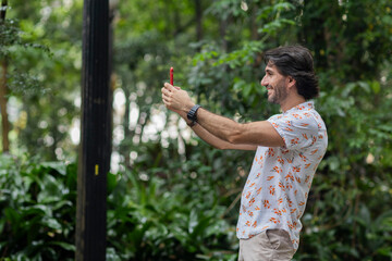 View of young man using a smartphone at twilight