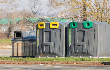 Large easy to remove recycling bins in a park in France