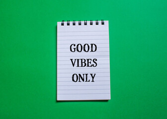 Good vibes only words written on notepad page with green background. Conceptual symbol. Copy space.