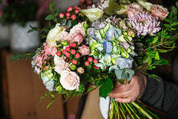 Person Holding Bouquet of Flowers