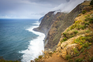 Fototapeta na wymiar cliffs of Ponta do Pargo, westernmost point of madeira, island, volcanic, atlantic ocean, portugal, europe, cloudy