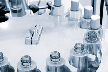 pharmaceutical industry, medicine pills are filling in the  bottle on production line machine conveyor at the medical factory. selective focus.